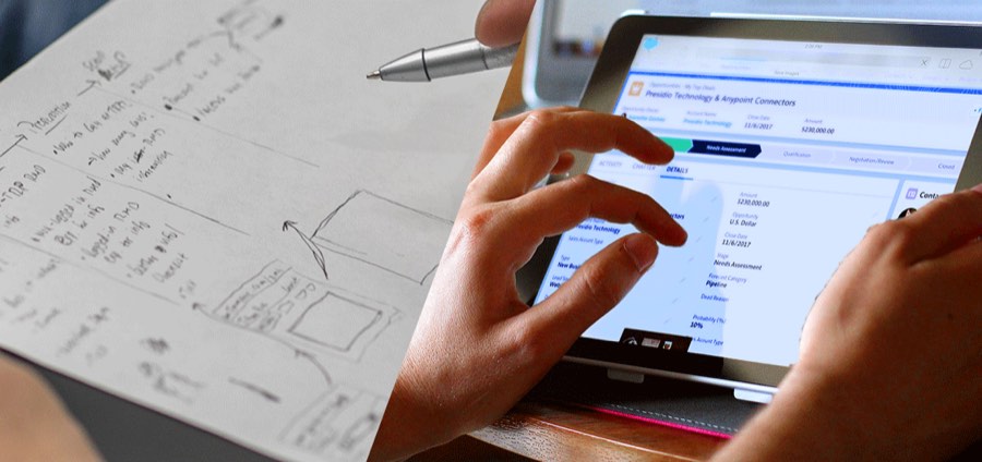 Sketched application plan beside the finished system on a tablet